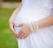 Zakaj boli želodec med nosečnostjo?
